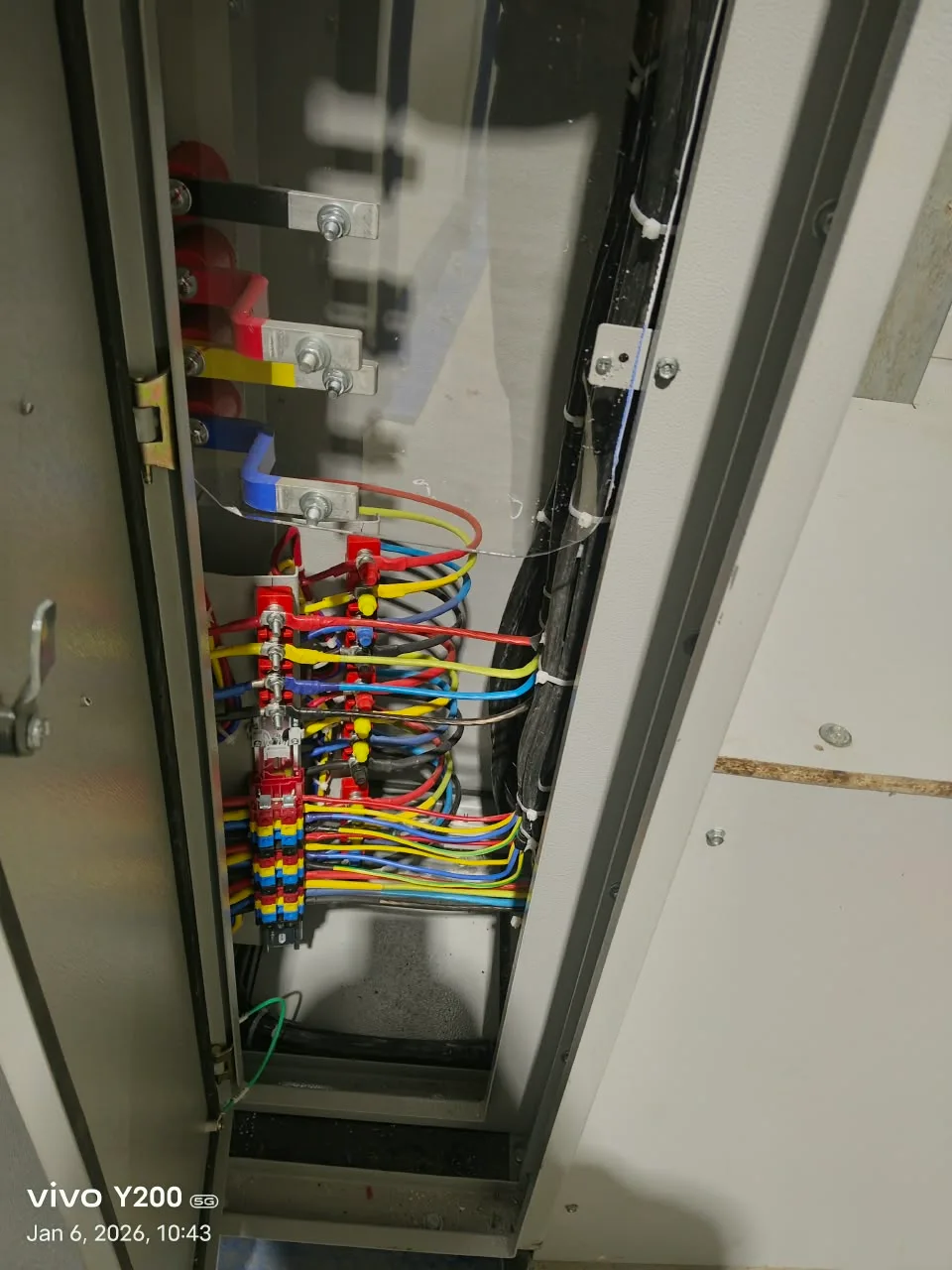 Close-up of colour-coded wiring inside an electrical panel