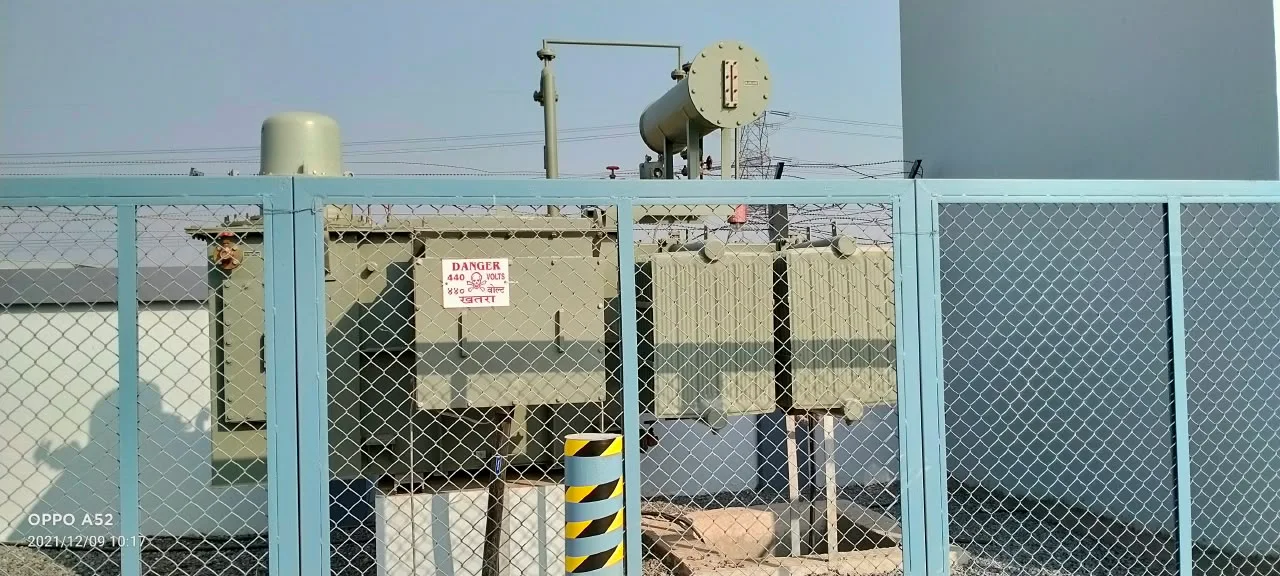 Fenced outdoor substation and transformer yard