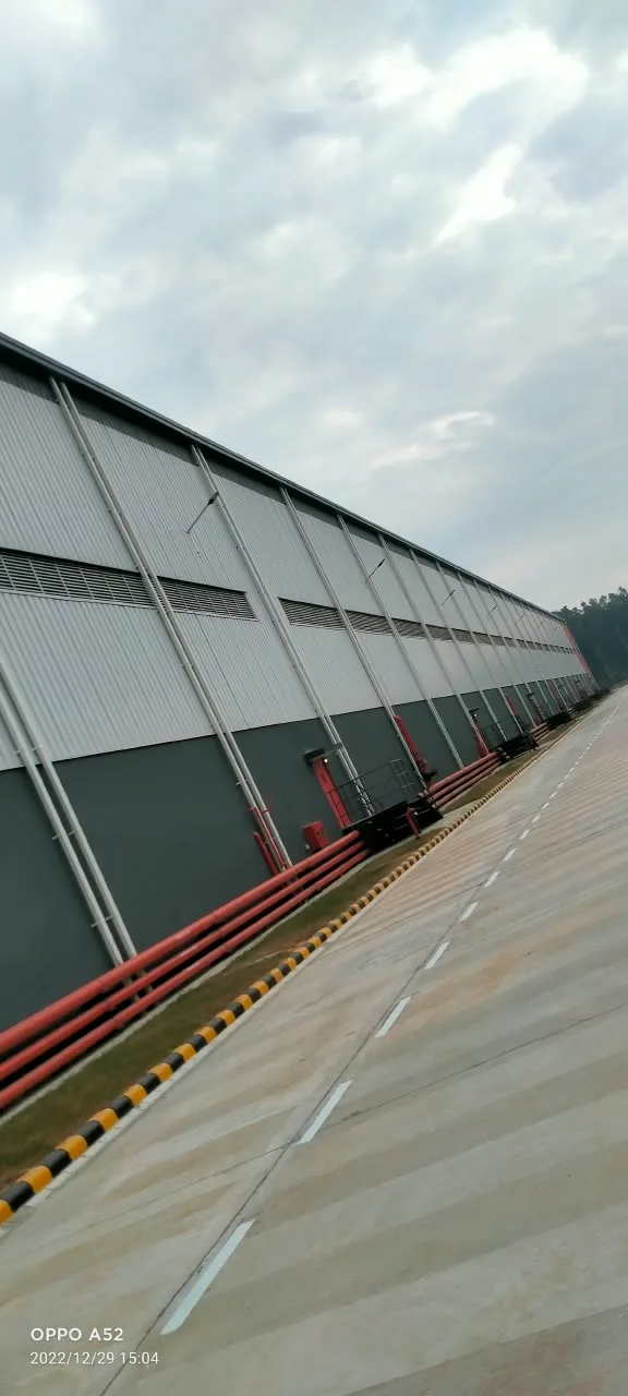 PEB warehouse exterior with metal wall cladding