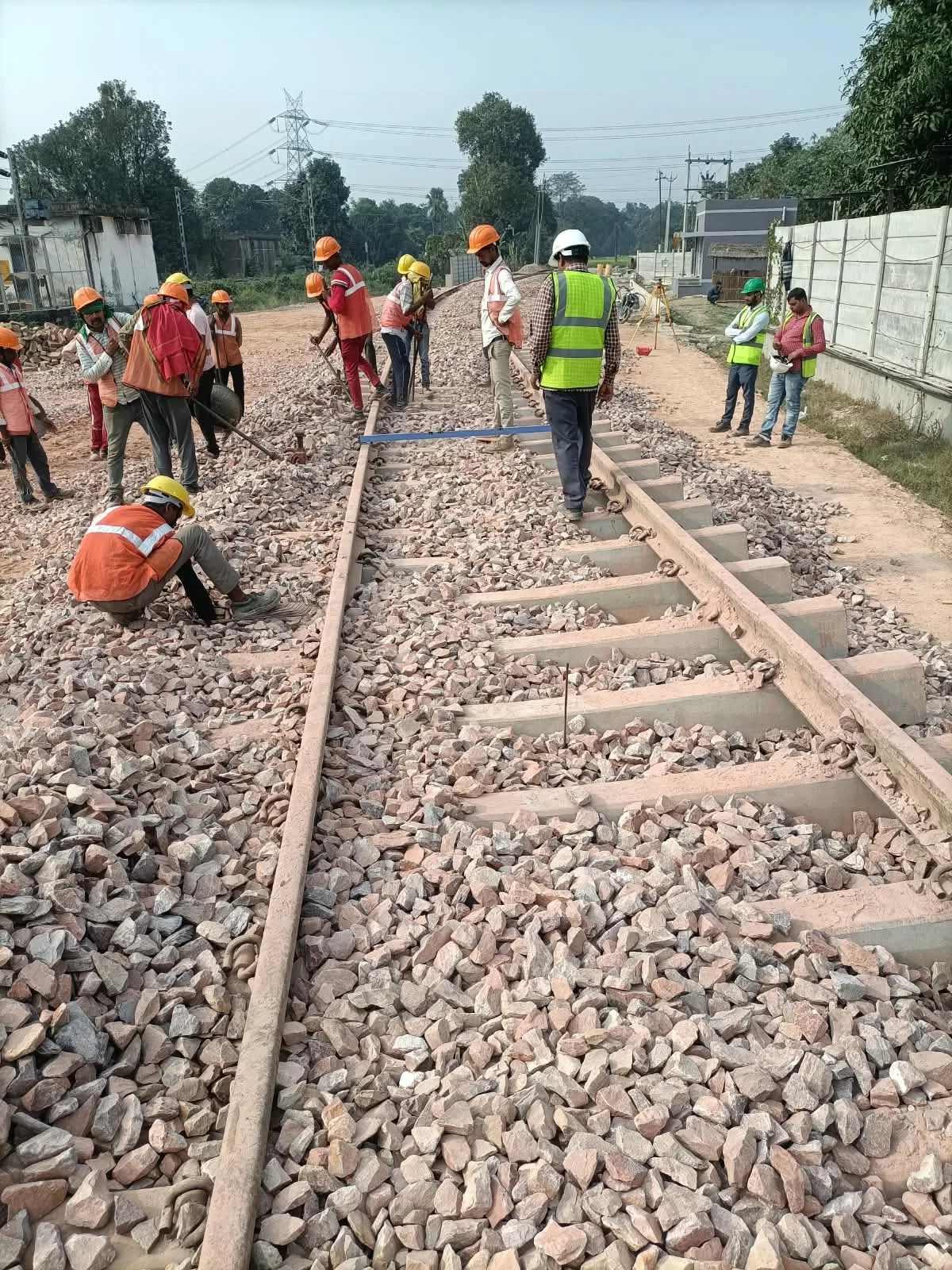 Track ballast packing and alignment work on a railway siding