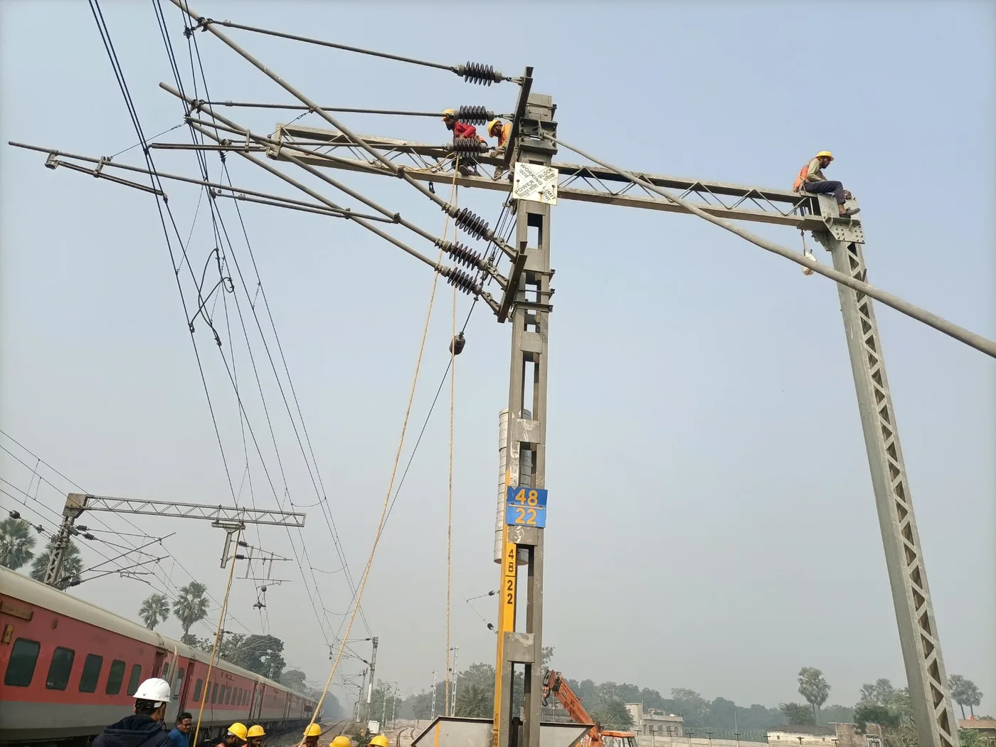 OHE gantry structure erection with linemen working at height