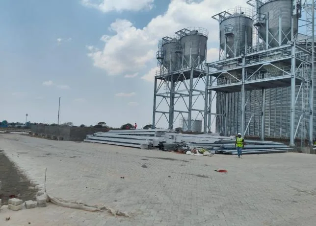 Silo structures with material stacked in the yard