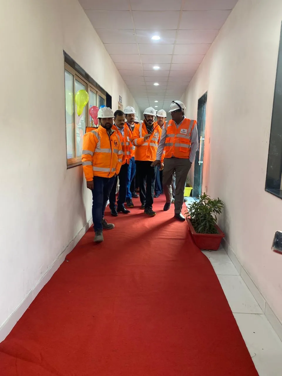 Client and team walking through a newly completed facility at its inauguration