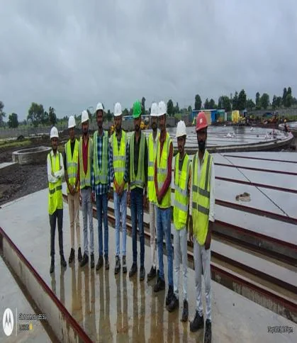 Site team beside stacked rails