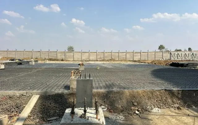 Wide paved yard at a rail-linked terminal