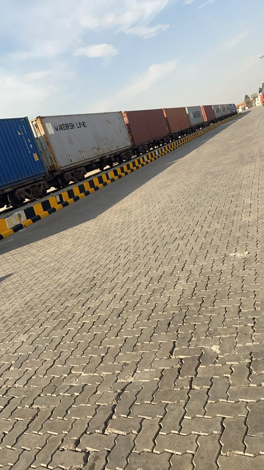 Paved yard alongside rail wagons at the Nagpur ICD